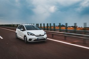 white honda jazz on the road